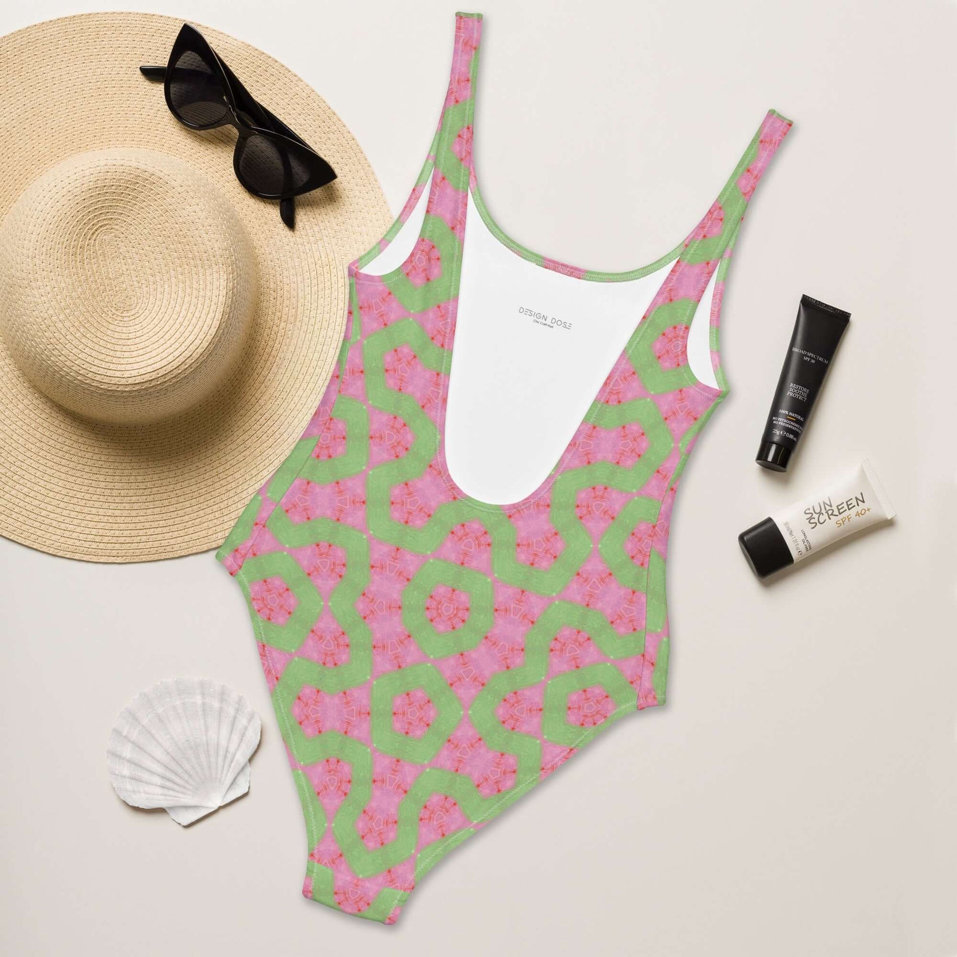 Dive into style with the Flamingo Breeze Swimsuit. Featuring trendy colors, 4-way stretch, a cheeky fit, and sizes 2XS to 6XL for all-day comfort! at Design Dose