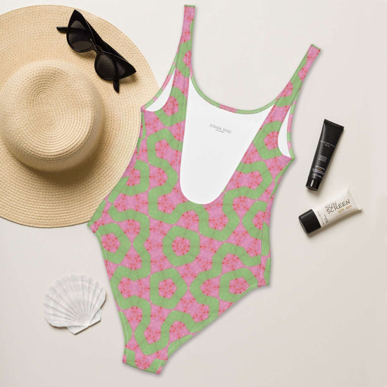 Dive into style with the Flamingo Breeze Swimsuit. Featuring trendy colors, 4-way stretch, a cheeky fit, and sizes 2XS to 6XL for all-day comfort! at Design Dose