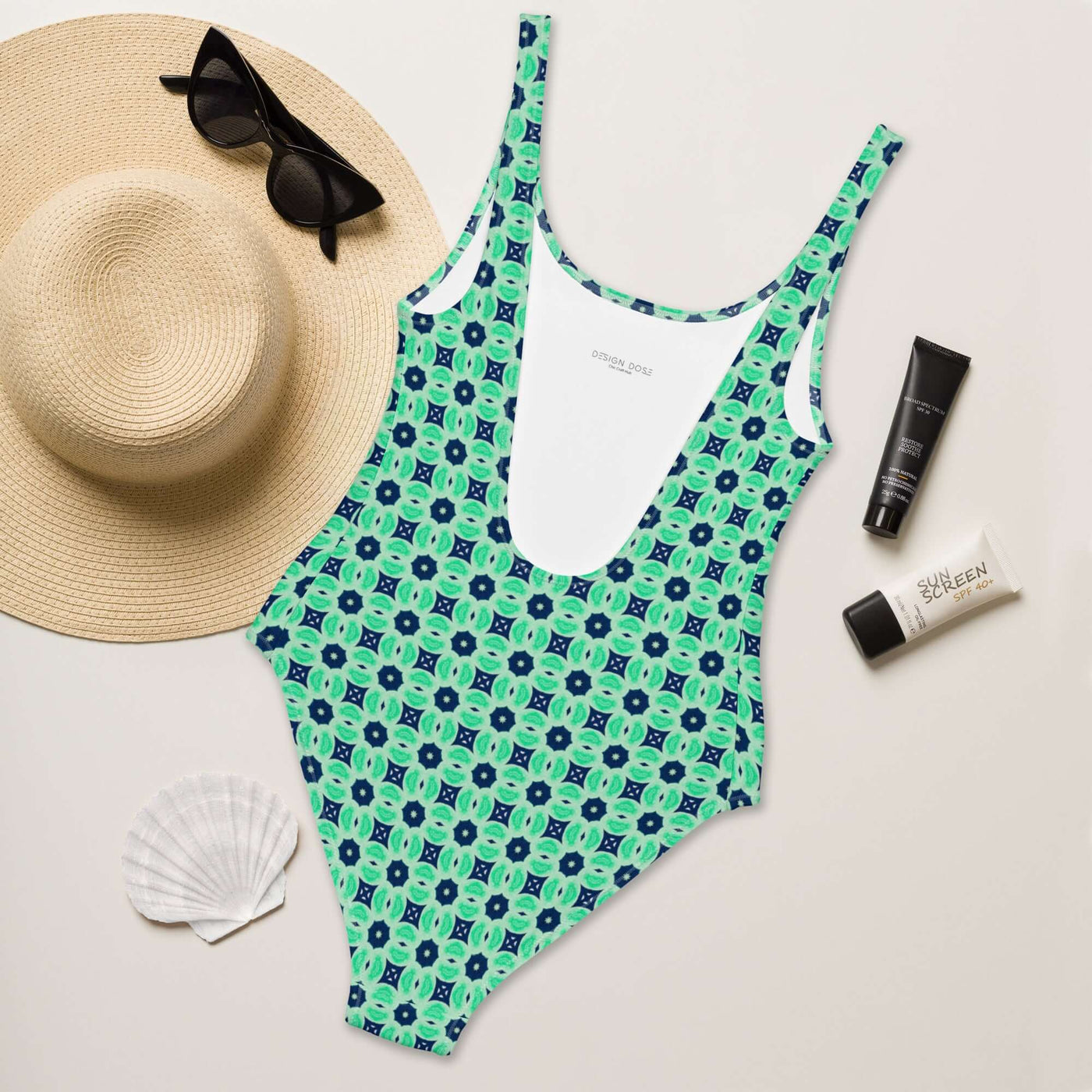 Dive into summer with the stylish Minted Echoes swimsuit! Enjoy 4-way stretch, low back, and cheeky fit. Durable, comfortable, and trendy colors. at Design Dose