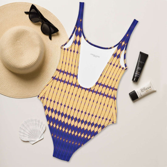 Discover chic comfort with our Bold Beads Swimsuit featuring 4-way stretch, low back, and cheeky fit. Perfect for a stylish beach look. at Design Dose