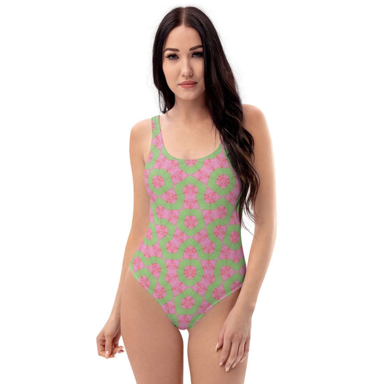 Dive into style with the Flamingo Breeze Swimsuit. Featuring trendy colors, 4-way stretch, a cheeky fit, and sizes 2XS to 6XL for all-day comfort! at Design Dose