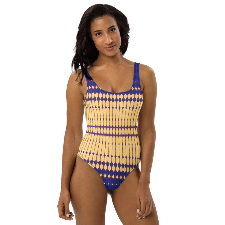 Discover chic comfort with our Bold Beads Swimsuit featuring 4-way stretch, low back, and cheeky fit. Perfect for a stylish beach look. at Design Dose