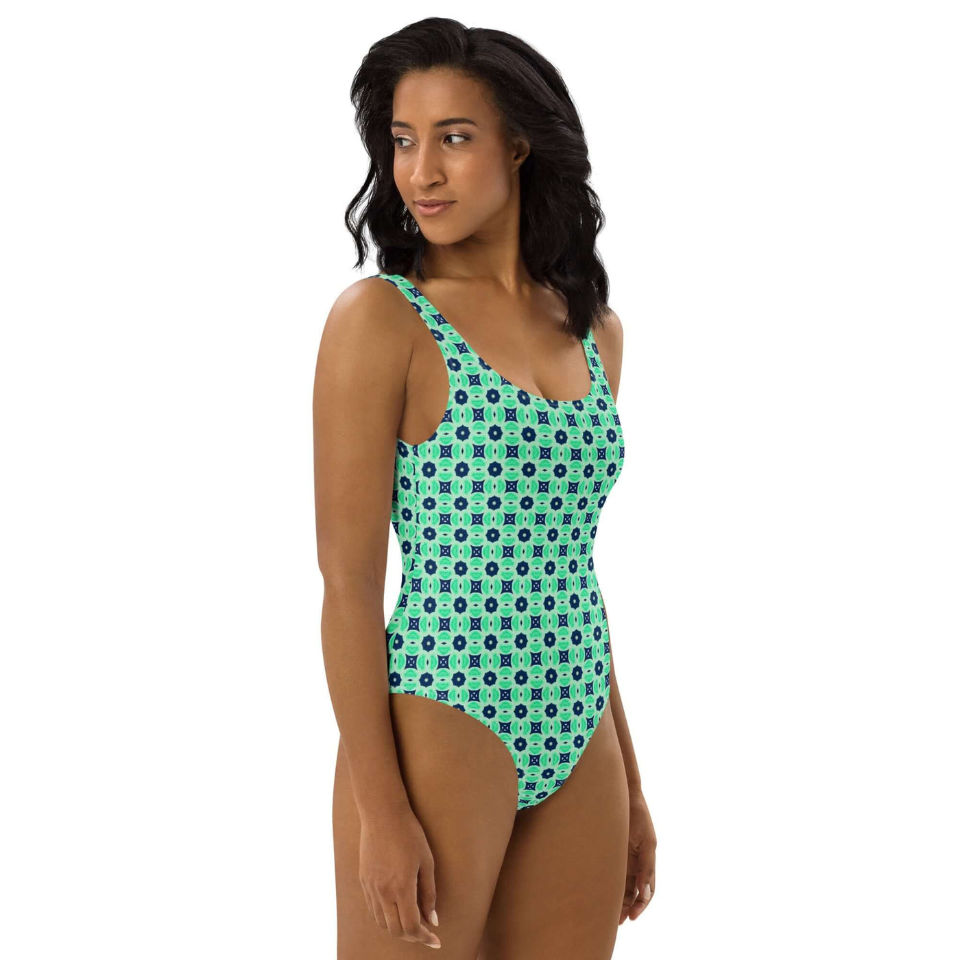 Dive into summer with the stylish Minted Echoes swimsuit! Enjoy 4-way stretch, low back, and cheeky fit. Durable, comfortable, and trendy colors. at Design Dose